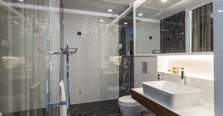 Interior of a luxury bathroom with glass shower cabin