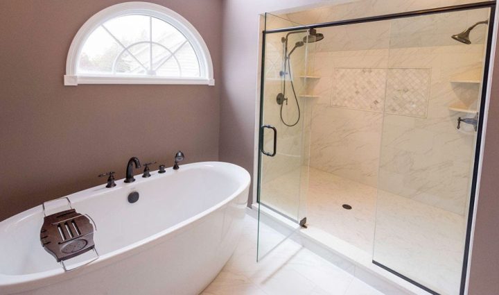 a minimalist master bathroom remodel, single bathtub and a double shower with glass enclosure
